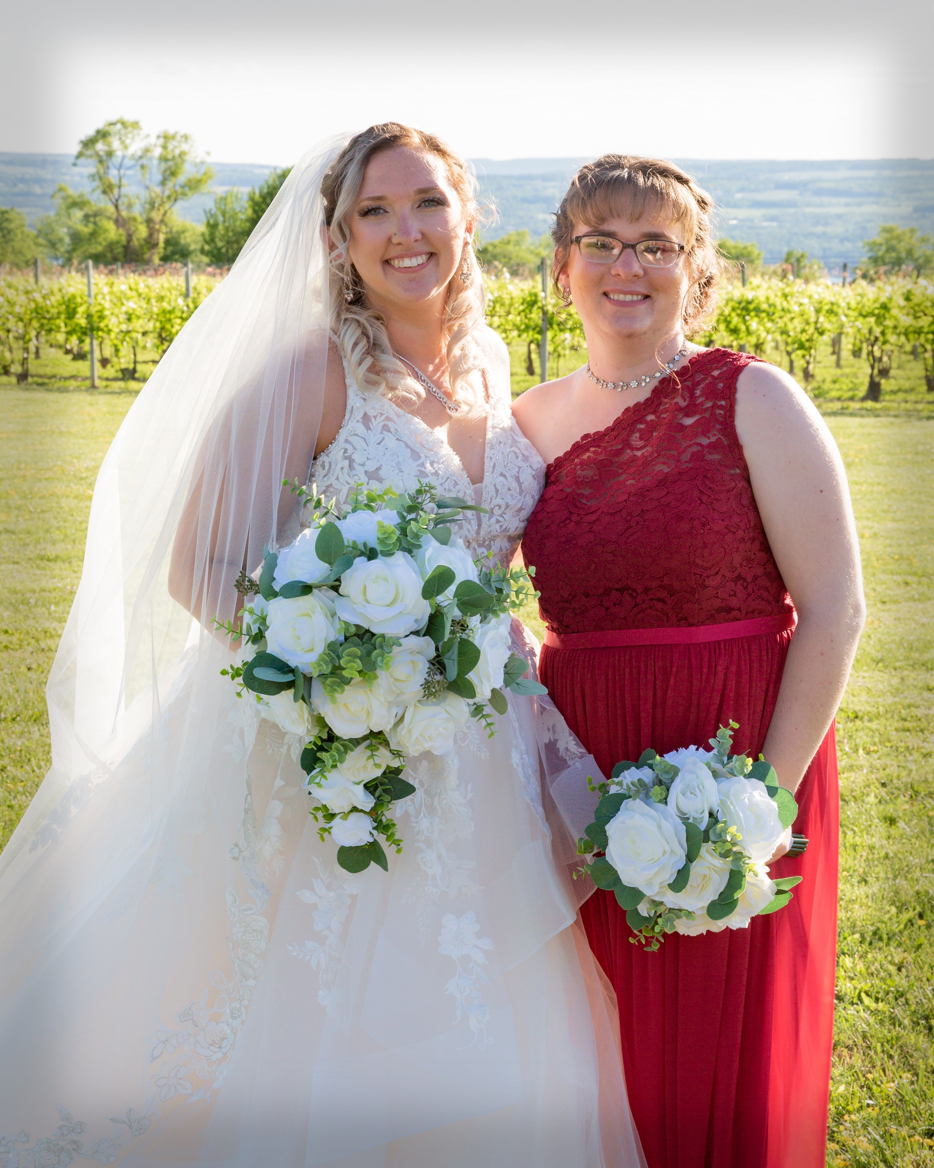 Bride and Bridesmaid Holding Bouquet